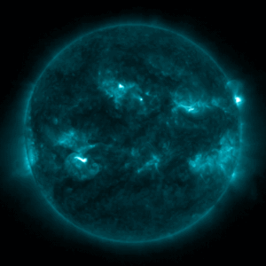 Animated extreme ultraviolet view of the Sun in blue, with bright flare flashes near its right edge