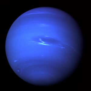 Neptune, a blue planet with a large dark storm spot and white streaks of cloud