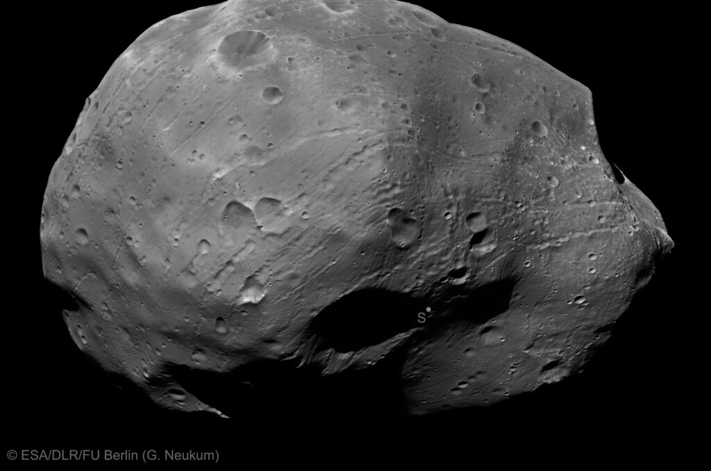 Grey, cratered and potato shaped moon Phobos seen up close by Mars Express